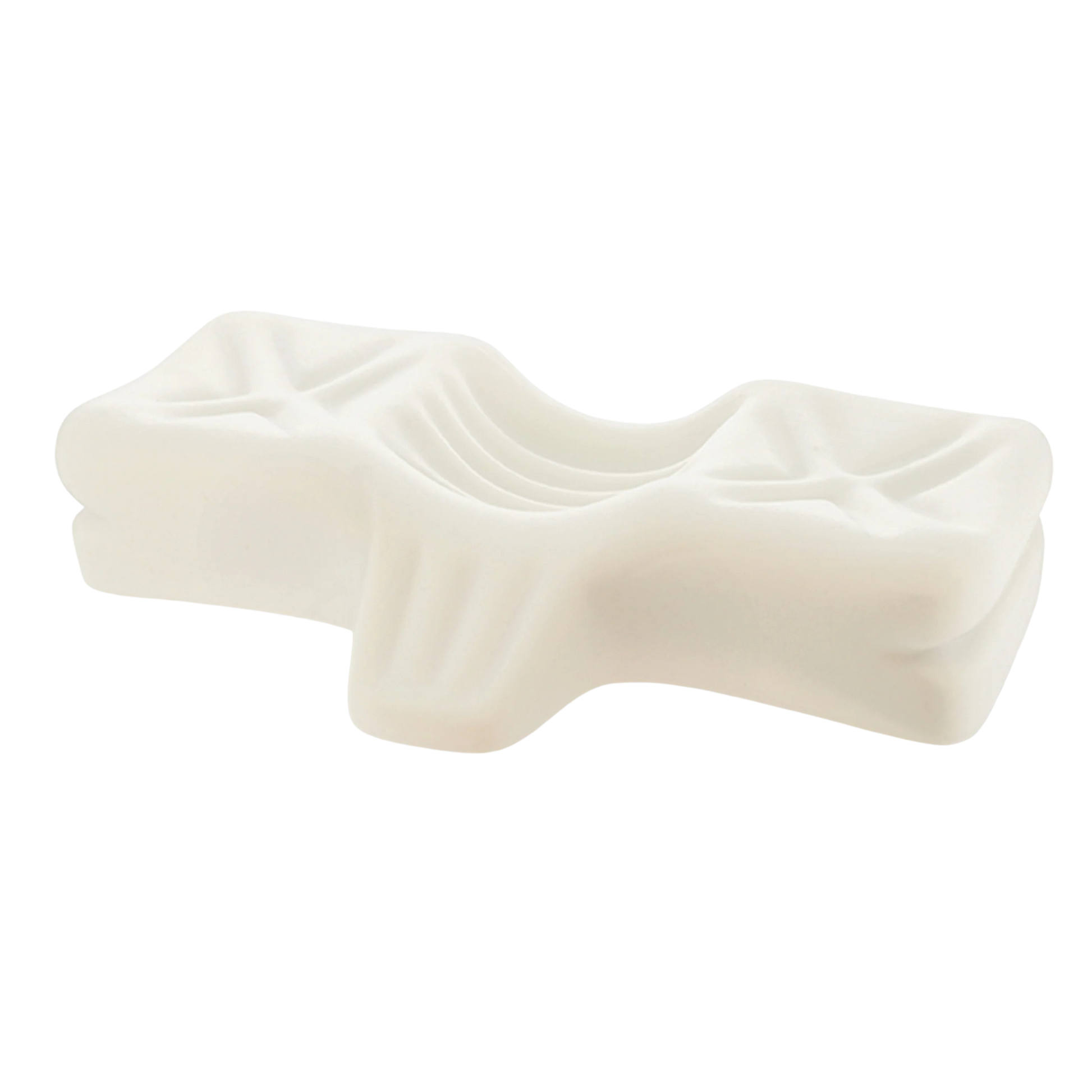 Close-up view of a contoured chiropractic pillow made from resilient molded foam, designed with ergonomic grooves to support natural neck and head alignment for pain relief.